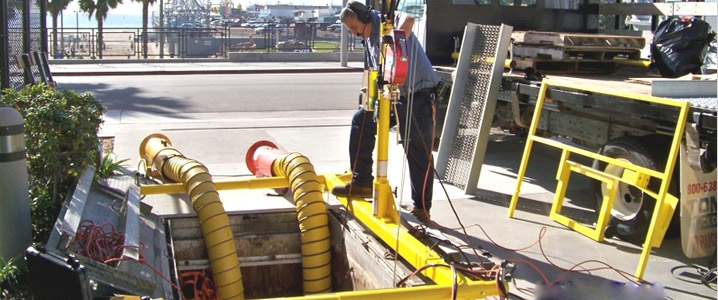 worker using an air pump for maintenance